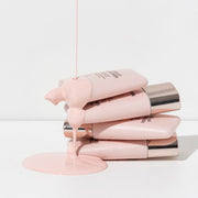 ProtoClinical k-beauty warm taupe beauty graphic with soft peach highlights on a light background.