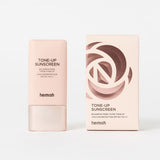 ProtoClinical k-beauty warm beige makeup swatch centered on a light background.