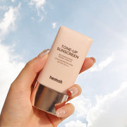 ProtoClinical k-beauty heimish Bulgarian Rose Tinted Tone-up Sunscreen SPF50+ PA+++ 30ml in a slim taupe bottle shown upright with soft rose side tones on a light background