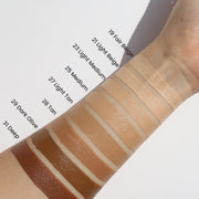 ProtoClinical k-beauty blended beige and taupe makeup swatch on a light background.