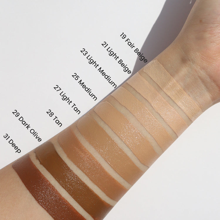 ProtoClinical k-beauty blended beige and taupe makeup swatch on a light background.