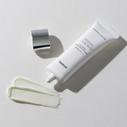 ProtoClinical k-beauty warm beige beauty product silhouette with soft olive and blush tones on a light background.