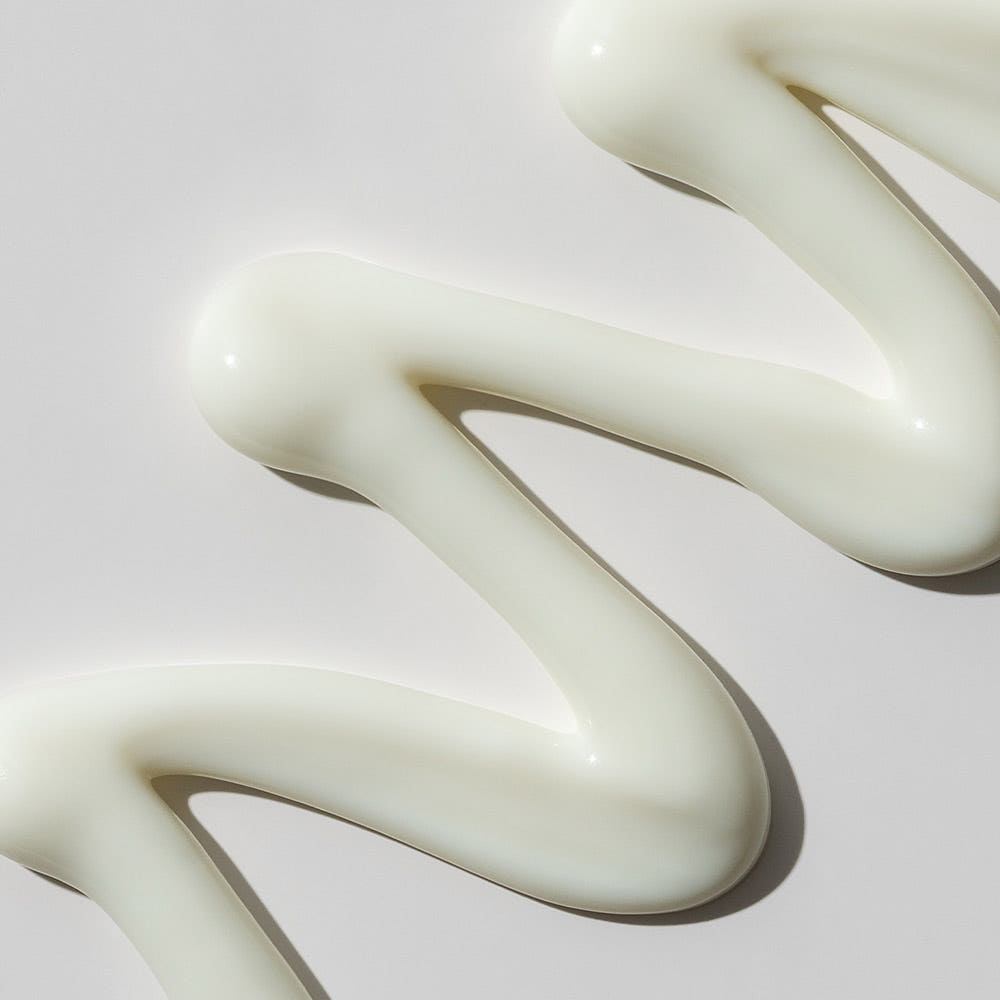 ProtoClinical k-beauty warm golden beauty product silhouette on a muted beige background.