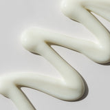 ProtoClinical k-beauty warm golden beauty product silhouette on a muted beige background.
