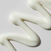 ProtoClinical k-beauty warm golden beauty product silhouette on a muted beige background.