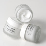 ProtoClinical k-beauty light gray beauty graphic with soft beige lower-right accents on a pale background.