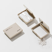 ProtoClinical k-beauty soft beige skincare product packaging on a light background.