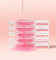 ProtoClinical k-beauty MEDICUBE: PDRN Pink One Day Serum 1box(1.5ml*) (10Units) five clear pink ampoules stacked horizontally beside a pink serum puddle on a pale peach background