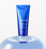 ProtoClinical k-beauty MEDICUBE: Zero Pore Blackhead Mud Mask (100g) single tall blue container centered on a light cream background with pale aqua side accents