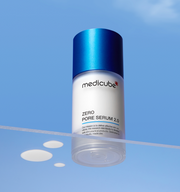 ProtoClinical k-beauty MEDICUBE: Zero Pore Serum 2.0 (37ml) single upright pale blue serum bottle with a dark blue cap on a light blue background