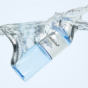 ProtoClinical k-beauty MEDICUBE: Zero Pore Toner (250ml) translucent blue toner bottle angled under a clear water splash with a white label