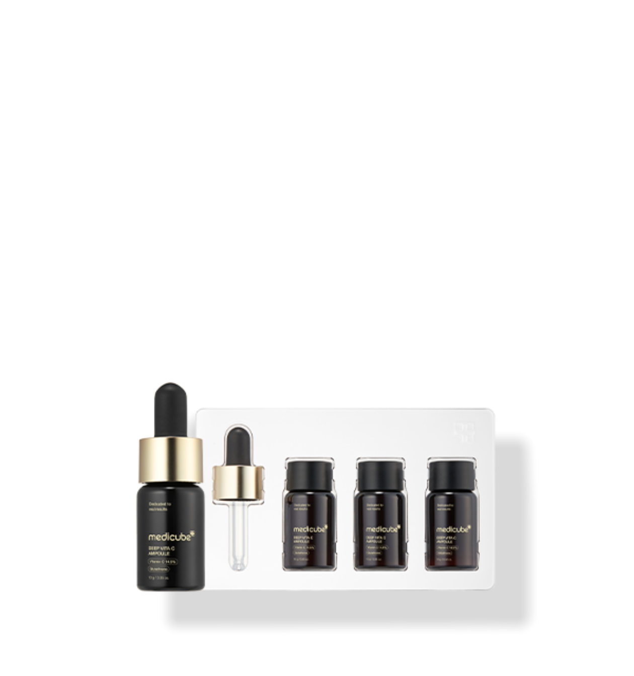 ProtoClinical k-beauty MEDICUBE: Deep Vita C Ampoule 2.0 (Ea) (10g x 3) open round jar with a matching lid above it on a dark charcoal background