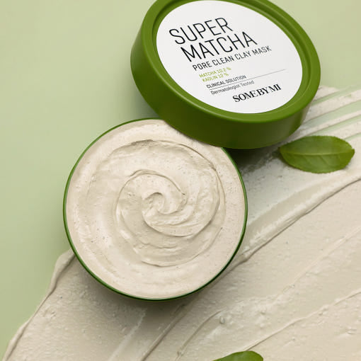 ProtoClinical k-beauty [SOME BY MI] Super Matcha Pore Clean Clay Mask 100g open olive green clay mask jar with beige cream, the matching lid, and a white clay smear on a pale green background