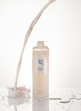 ProtoClinical k-beauty [Beauty of Joseon] Glow Replenishing Rice Milk 150ml single upright pale gray bottle centered on a white background with soft gray side shading