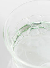 ProtoClinical k-beauty [Beauty of Joseon] Green Plum AHA BHA Toner 150ml close-up of clear gel bubbles and pale green liquid inside a translucent glass dish on a white background