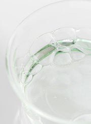ProtoClinical k-beauty [Beauty of Joseon] Green Plum AHA BHA Toner 150ml close-up of clear gel bubbles and pale green liquid inside a translucent glass dish on a white background