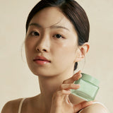 ProtoClinical k-beauty KAINE Green Calm Aqua Cream 70ml in a tall aqua product graphic with a darker teal center and soft peach side accents on a light background.