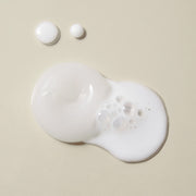 ProtoClinical k-beauty pale beige beauty graphic with a muted lavender gray center on a light background.