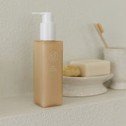 ProtoClinical k-beauty tall tan skincare product centered on a soft neutral background.