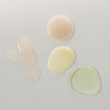 ProtoClinical k-beauty skincare product packaging on a light background.