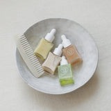 ProtoClinical k-beauty skincare product packaging on a light background.