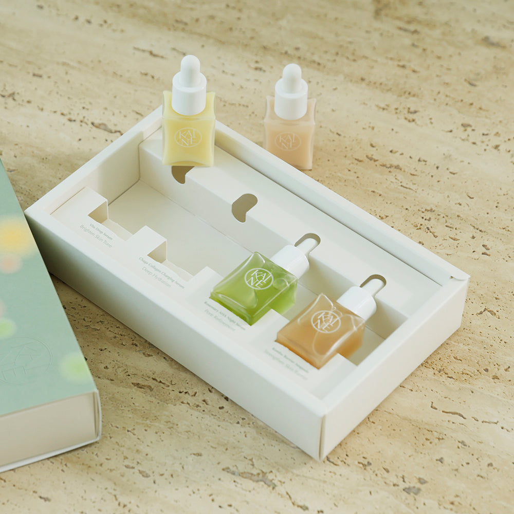ProtoClinical k-beauty skincare product packaging on a light background.