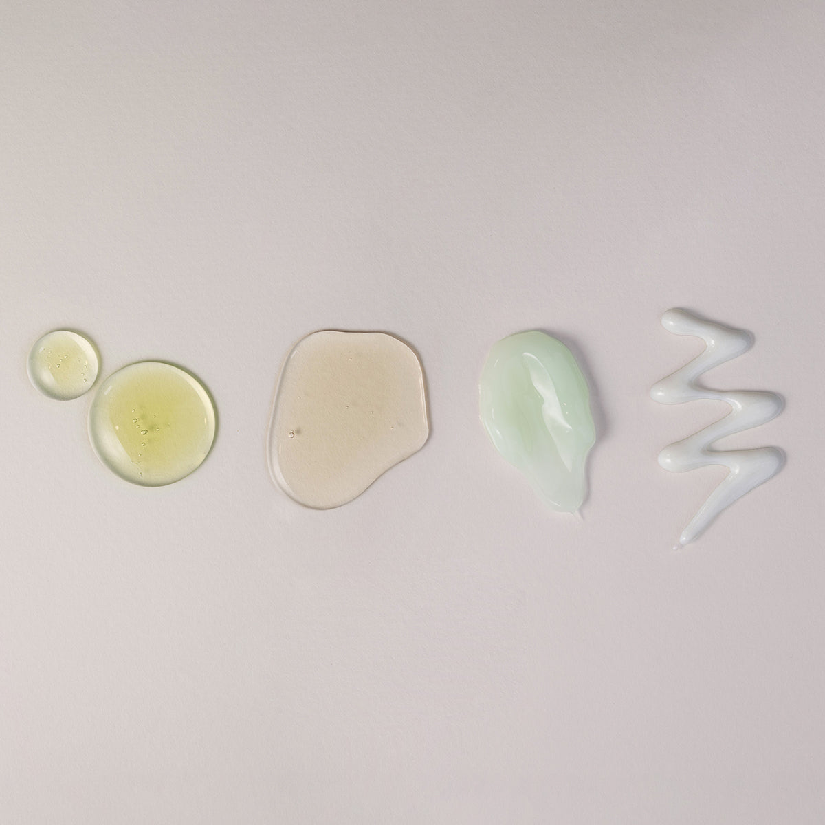 ProtoClinical k-beauty skincare product packaging on a light background.