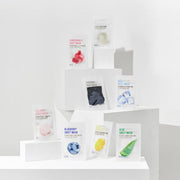 ProtoClinical k-beauty product packaging on a light background.