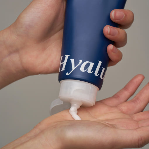 ProtoClinical k-beauty EUNYUL Time Foam Me Hyaluronic Cleansing Foam 150ml single dark blue cleansing foam tube centered on a warm beige and peach background