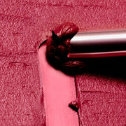 ProtoClinical k-beauty Oddtype Unseen Blur Tint (562, 655, 788) horizontal dark berry lip tint swatch centered across a pink and mauve background