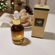 ProtoClinical k-beauty EUNYUL Snail Ampoule 30ml single upright amber-brown ampoule bottle centered on a warm beige background