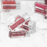 ProtoClinical k-beauty MUZIGAE MANSION Icy Glow 5ml single mauve cylindrical bottle with a dark cap centered on a pale blue and lavender background