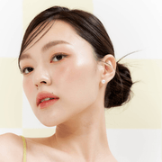 ProtoClinical k-beauty MUZIGAE MANSION Icy Glow 5ml single peach cylindrical bottle with a dark cap standing upright on a soft blue and white background