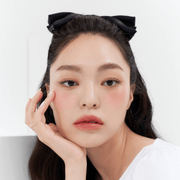 ProtoClinical k-beauty MUZIGAE MANSION Icy Glow 5ml single rosy brown cylindrical bottle with a dark cap standing upright against a pale aqua and white background