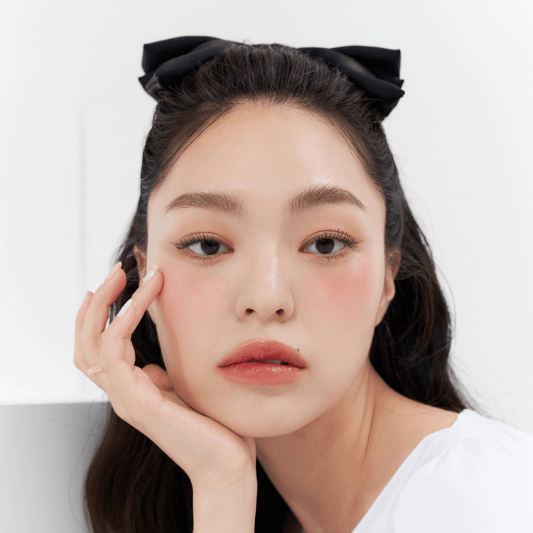 ProtoClinical k-beauty MUZIGAE MANSION Icy Glow 5ml single rosy brown cylindrical bottle with a dark cap standing upright against a pale aqua and white background