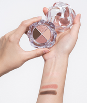 ProtoClinical k-beauty rosy brown beauty product silhouette centered on a pale background with soft blue side accents.