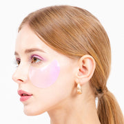 ProtoClinical k-beauty K-SECRET Advanced Regenerating Eye Gel Patches 60ea/102g #RETINOL female model close-up with warm skin tones and a pale aqua side panel