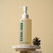 ProtoClinical k-beauty warm beige beauty product silhouette with a muted olive center on a light background.