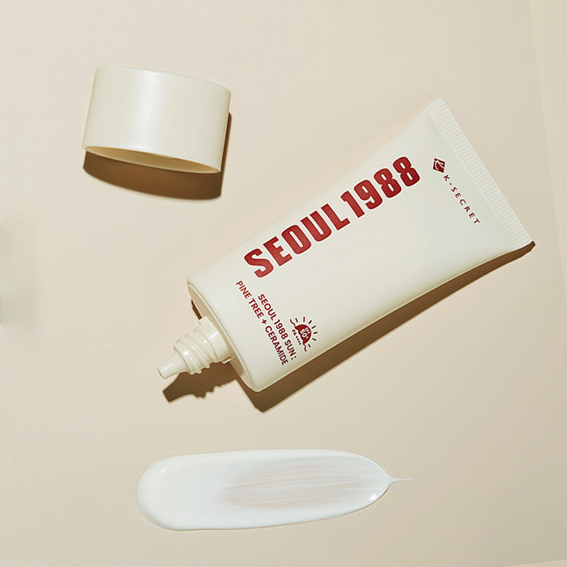 ProtoClinical k-beauty K-SECRET SEOUL 1988 Sun : Pine Tree + Ceramide 50ml product packaging on a beige background.