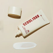 ProtoClinical k-beauty K-SECRET SEOUL 1988 Sun : Pine Tree + Ceramide 50ml product packaging on a beige background.