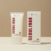 ProtoClinical k-beauty K-SECRET SEOUL 1988 Sun : Pine Tree + Ceramide 50ml product packaging on a beige background.