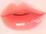 ProtoClinical k-beauty [MACQUEEN New York] Dewy Water Glow Lip Tint 3.5g (9 Color) single warm coral lip tint swatch in a rounded teardrop shape on a pale blue and mint background