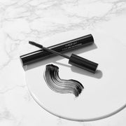 ProtoClinical k-beauty [MACQUEEN New York] Extreme Longlash Potencara 8g single dark angled mascara silhouette on a white background with soft lavender side shading
