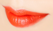ProtoClinical k-beauty [MACQUEEN New York] Hot Place In Lipstick 3.5g #03 Apgujung Orange horizontal orange lipstick swatch centered on a pale aqua and cream background