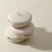 ProtoClinical k-beauty [MACQUEEN New York] Micro Fit Cover Powder 9g single round powder compact centered on a beige and white background