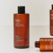 ProtoClinical k-beauty deep red-brown beauty product silhouette with pale side tones on a light background.
