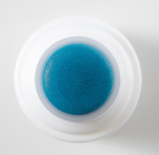 ProtoClinical k-beauty deep blue beauty product silhouette centered on a pale background with soft peach corners.