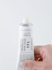 ProtoClinical k-beauty pale blue beauty graphic with a muted beige block at the lower right on a light background.