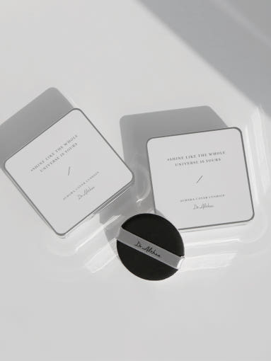ProtoClinical k-beauty gray beauty graphic with a dark rounded center and pale side panels on a light background.