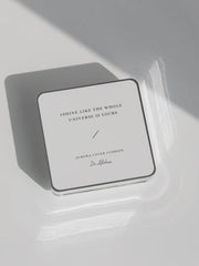 ProtoClinical k-beauty muted beige and gray beauty graphic with layered horizontal bands on a pale background.